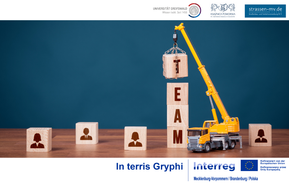 Symbolic image: A crane places the final block labeled “Team” onto a tower of wooden cubes – representing the completion of the project team.